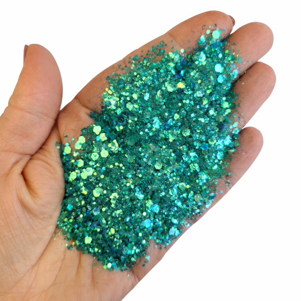 chunky teal glitter in a hand for crafting