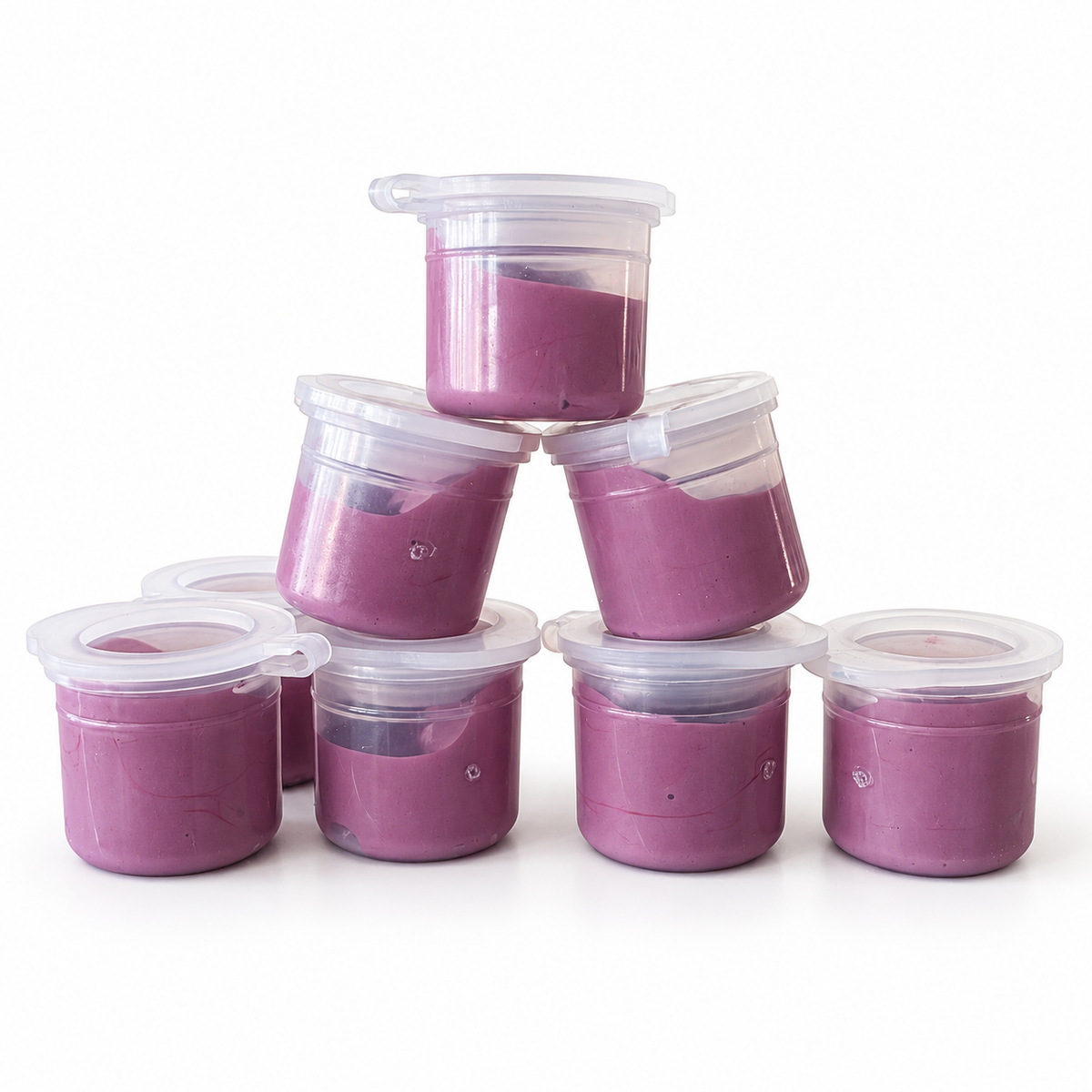 Eight clear tester pots of Isabel moody mauve epoxy resin pigment, arranged in a stack against a white background.