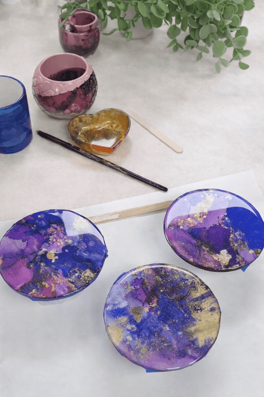 alcohol ink coasters with a resin top coat.
