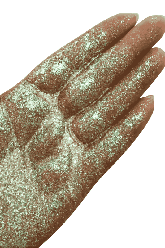 green interference glitter in hand, for resin crafts and mixed media