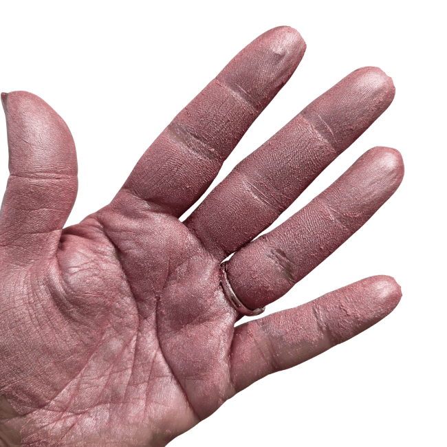 Soft baby pink paint powder in palm of hand