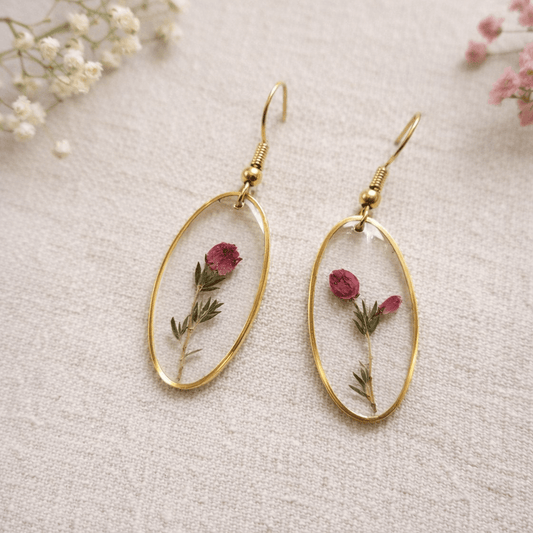 Earrings made from resin on fabric background