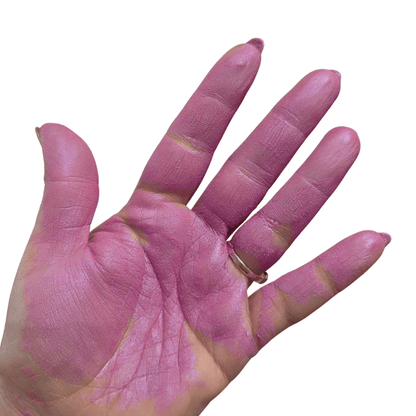 Hand with hot cute pink coloration on a white background
