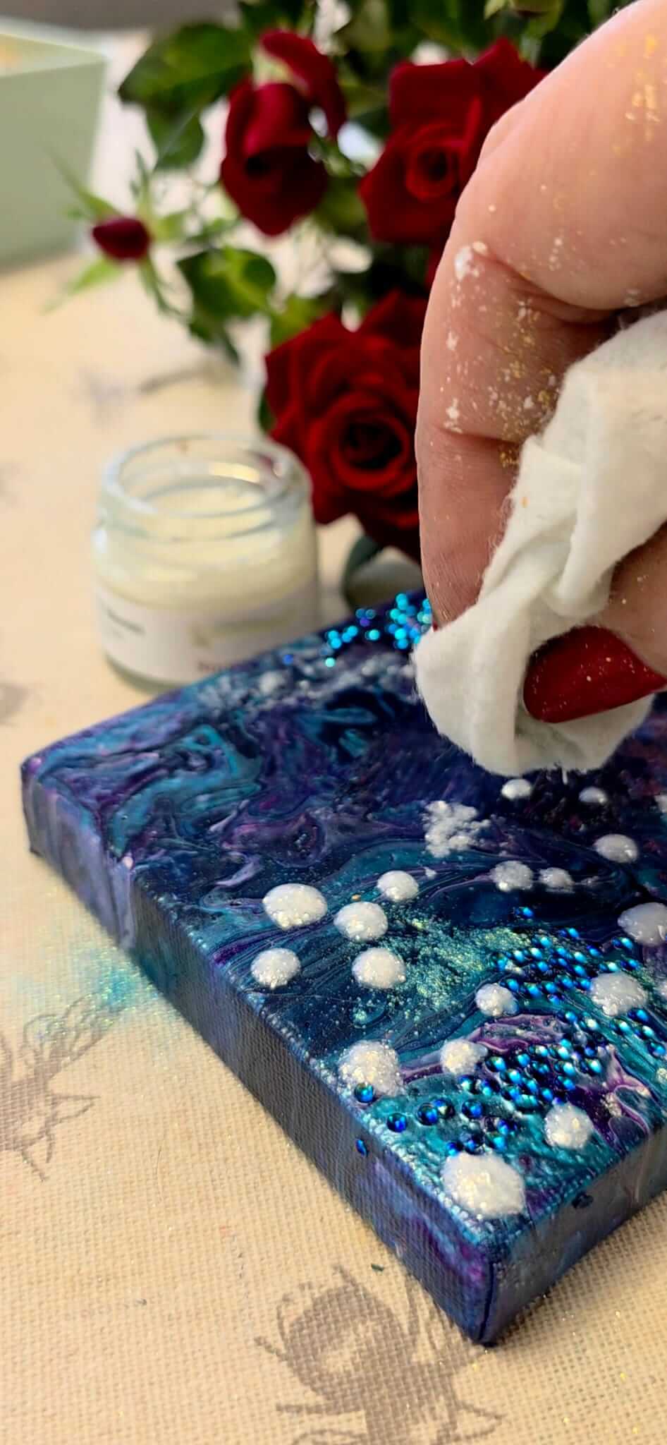 Lagoon orb glitter showing textured dark blue mixed media, glitter on an Acrylic pour, glitter for ocean resin. 