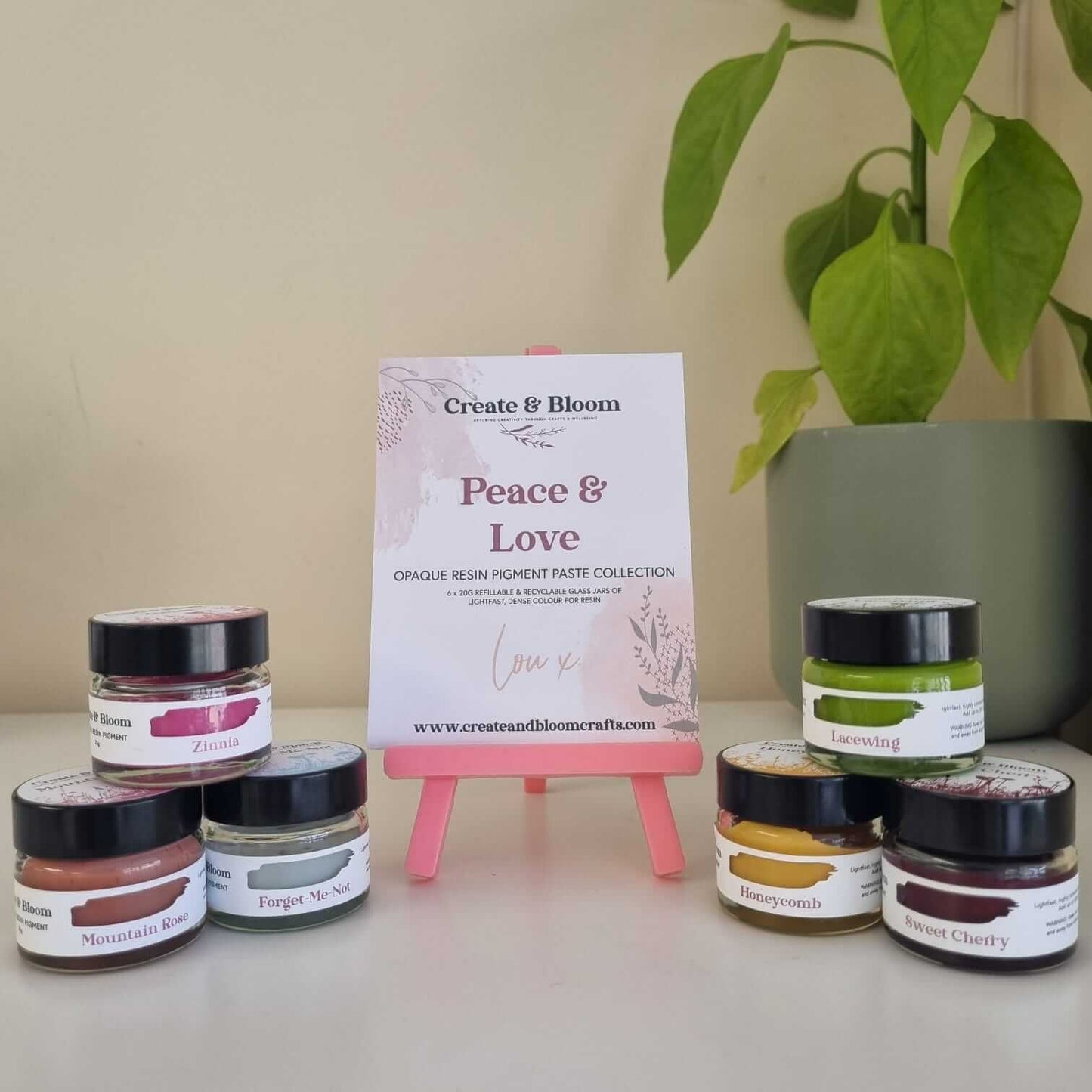 Opaque resin pigment collection featuring deep red, coral pinks, greens and rich golden tones for resin art.