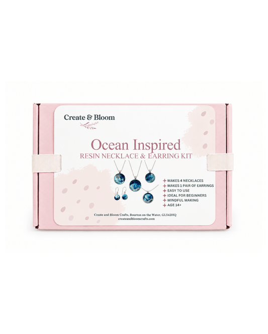 A pink rectangular product box for a Create & Bloom 'Ocean Inspired Resin Necklace & Earring Kit' on a plain white background.
