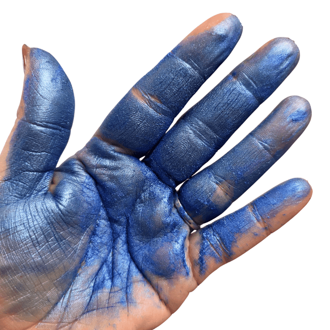 Hand with blue mica powder on a white background