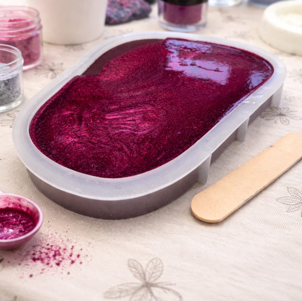Cherry red mica in resin in a tray mould