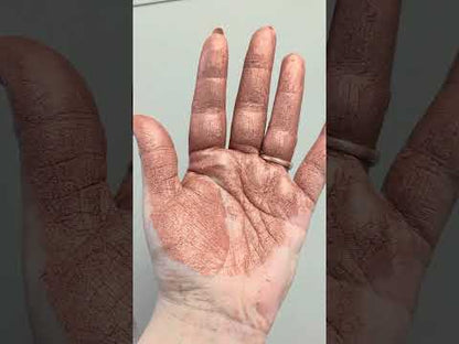 Moving hand demonstrating pigment powder - rose gold, sandy nude colour