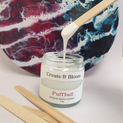 Puffball White opaque epoxy resin pigment paste beside resin art with white lacing and cell effects